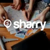 логотип і назва компанії Sharry на фоні карти та фотографій різних локацій Європи